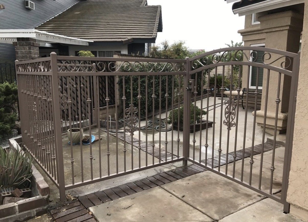 Bronze iron courtyard gate with scrollwork