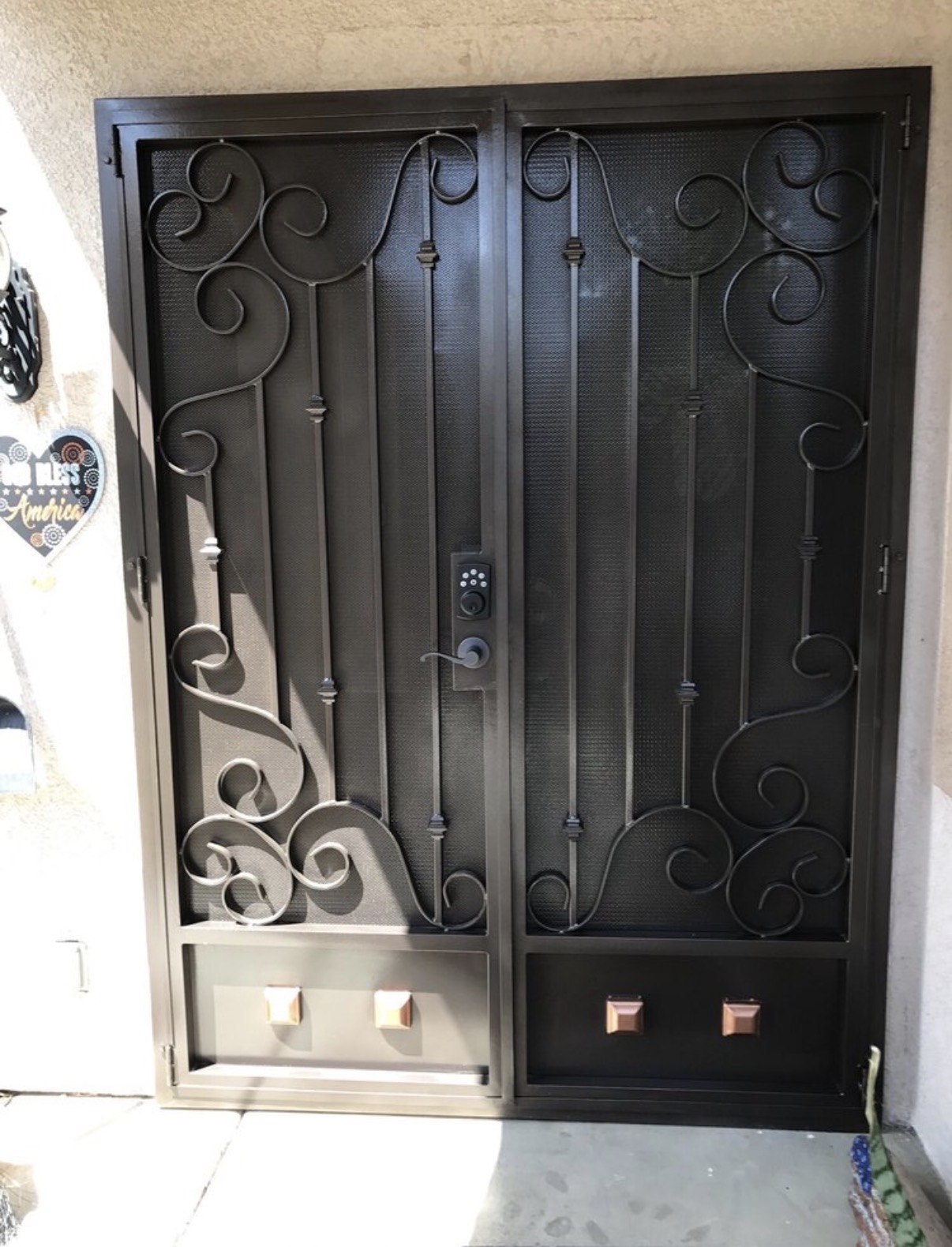 Custom iron double security door with scrollwork