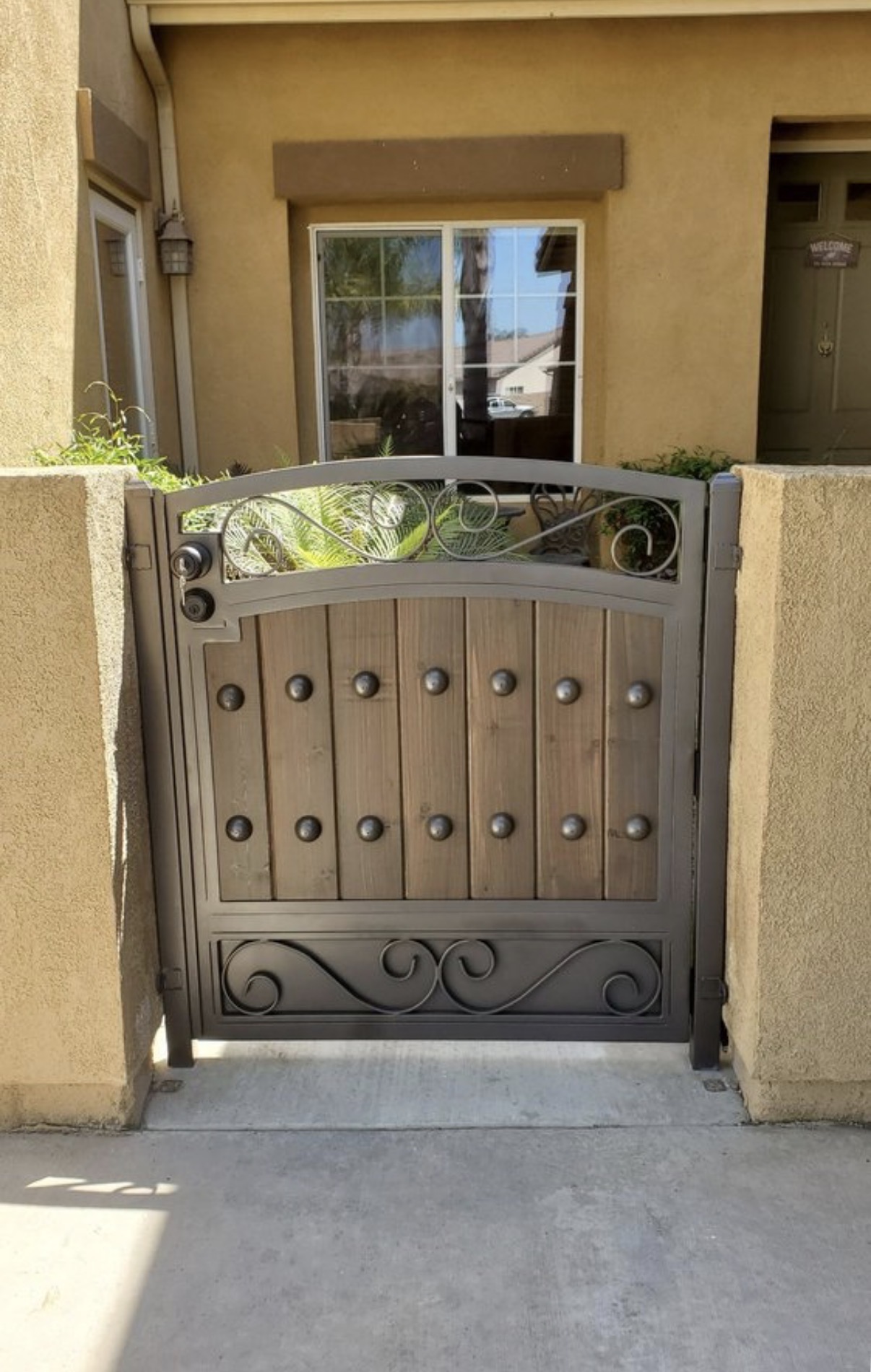 Bronze wood and iron pedestrian gate