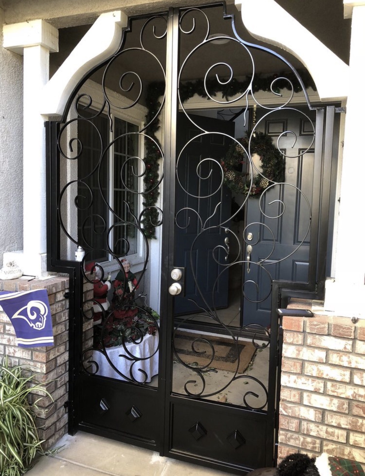 Custom wrought iron security door with scrollwork