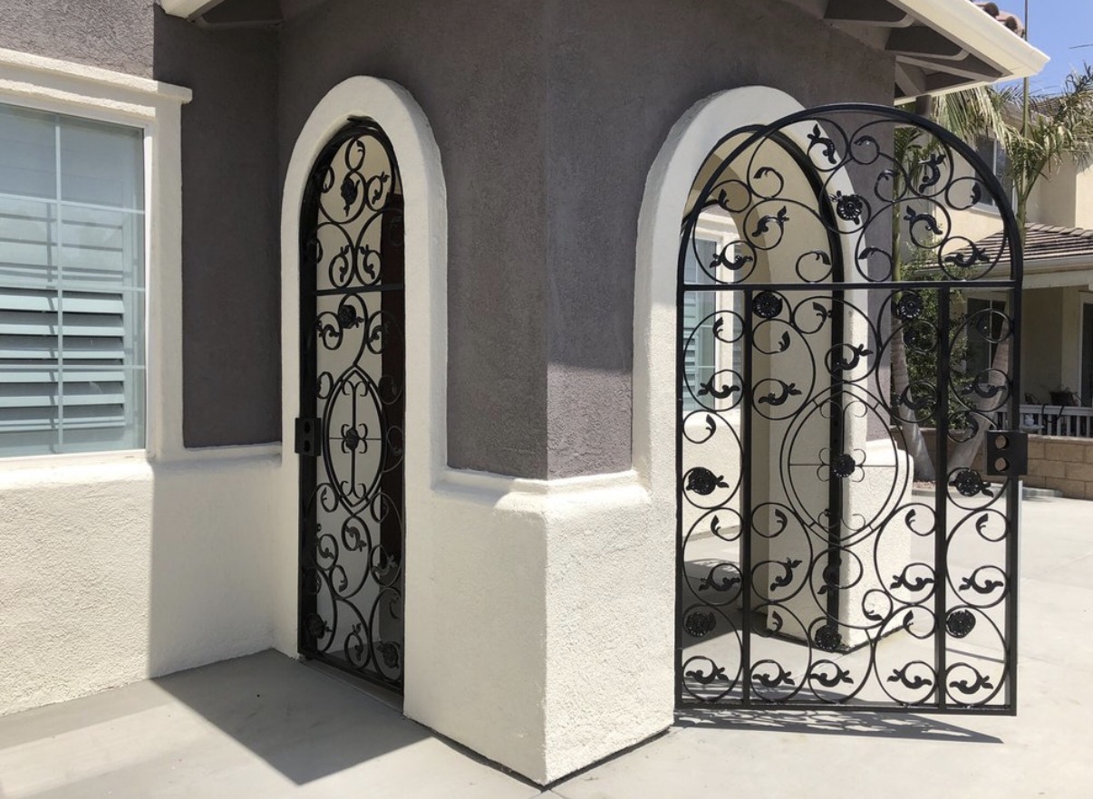 Arched wrought iron garden gates