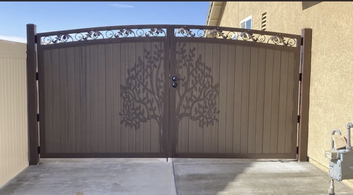 Bronze iron driveway gate with tree-of-life cutout design